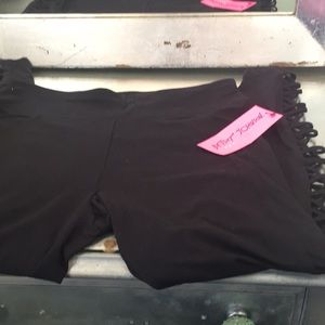 Black workout pants with cutout on leg
